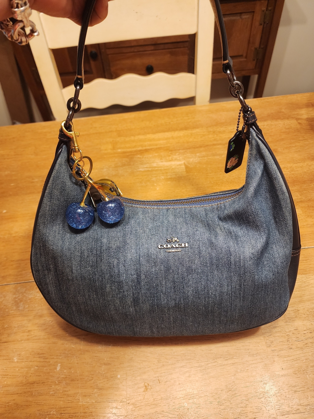 Coach Indigo Denim  Hobo Bag featuring dark blue leather accents